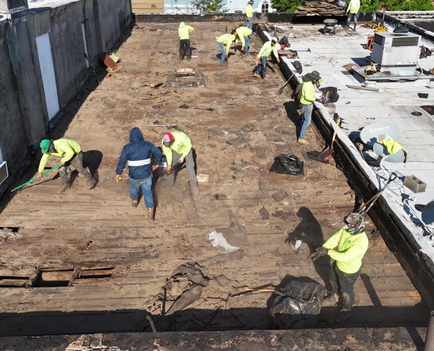 Workers replacing roof